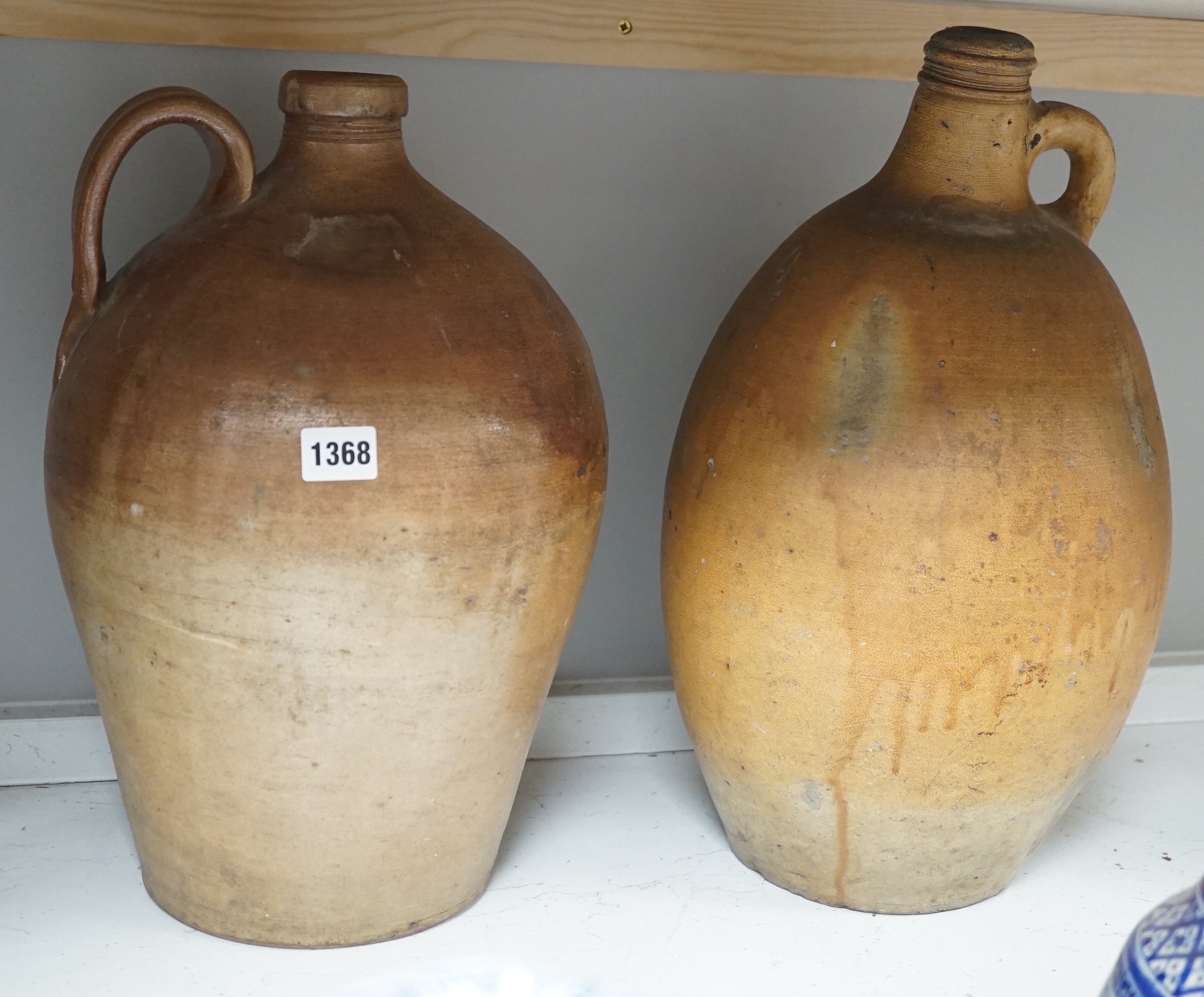 Two 19th century salt glazed stoneware flagons, tallest 44cm